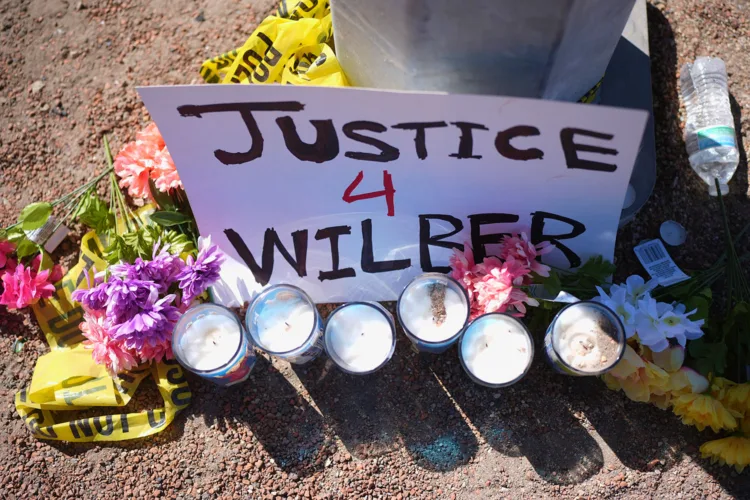 Man shot by ICE officer detained